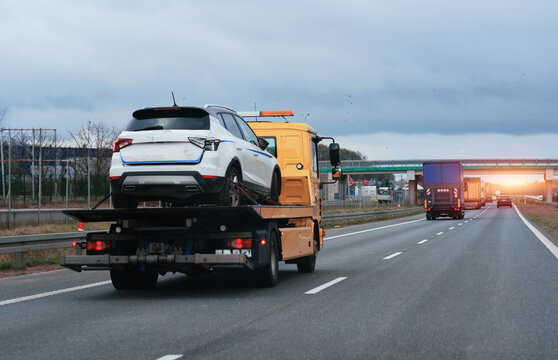 Towing Truck With A Damaged Vehicle After Car Accident Collision