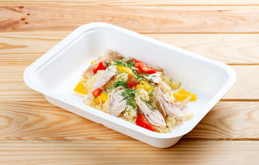 Turkey bulgur. Healthy food. Takeaway food.  On a wooden background.