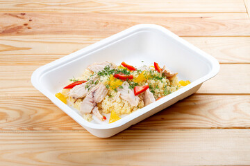 Turkey bulgur. Healthy food. Takeaway food.  On a wooden background.