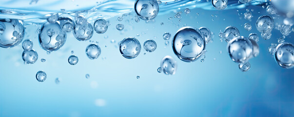 Water bubbles on wide white blue background.