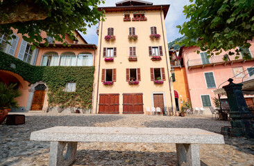 Travel by Italy. Facade of old house with flowers.