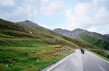 Moto trip. Lifestyle and travel. Beautiful landscape. A road through the Swiss Alps, Switzerland.