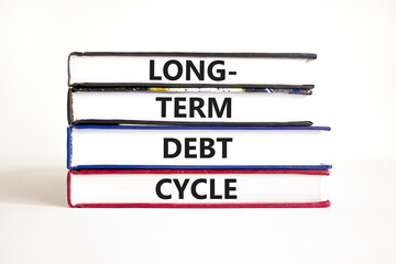 Long-term debt cycle symbol. Concept words Long-term debt cycle on beautiful books. Beautiful white table white background. Business Long-term debt cycle concept. Copy space.