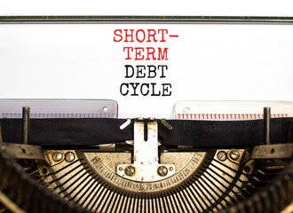 Short-term debt cycle symbol. Concept words Short-term debt cycle typed on beautiful old retro typewriter. Beautiful white background. Business Short-term debt cycle concept. Copy space