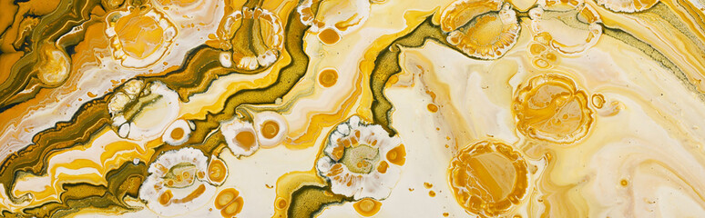 art photography of abstract marbleized effect background with yellow, gold and white creative colors. Beautiful paint.