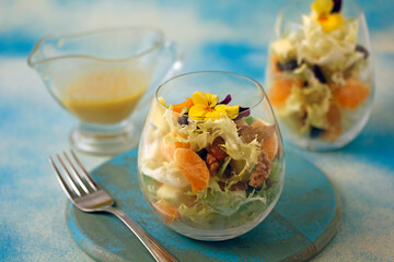 Escarole salad with tangerines.