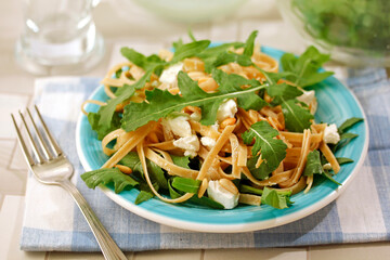 Tagliatelle with rocket salad.