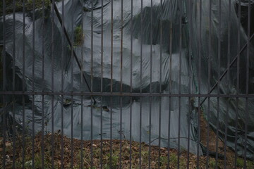 Plastic bag behind a fence