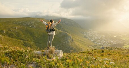 Woman, mountain top and freedom, hiking goals, celebration or travel achievement in nature...
