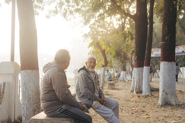 Chawkbazar, Chittagong/Bangladesh- 6 February 2024: A few old-aged friends working out in the early morning on a ground.