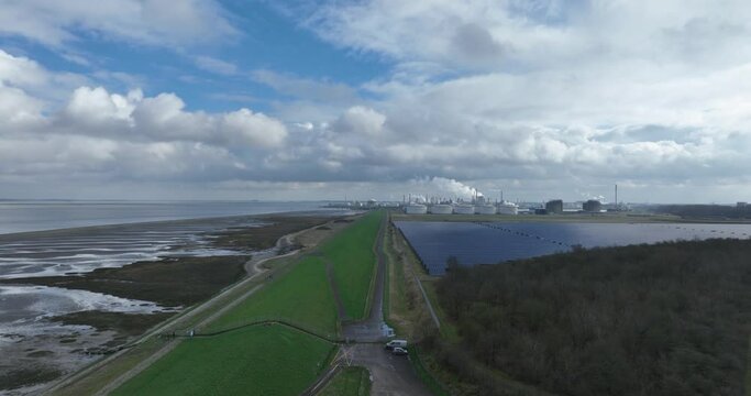 Chemical industry at terneuzen. DOW chemical park and petrochemical storage containers. Smokestacks and heay industry. Birds eye aerial drone view.