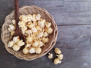 Popcorn caramel on brown wood background
