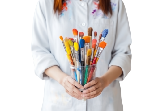 Woman painter hands holding set of paintbrushes and oil paints isolated on transparent and white background.PNG image.