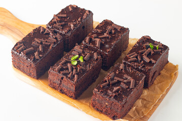 Delicious chocolate brownies with mint on white background. Sweet cake concept. 