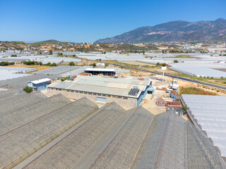 Panoramic drone view of vast landscape of greenhouses in Manavgat, Antalya, Turkey . Greenhouses for year-round cultivation of vegetables in Dembra Turkey. Concept of growing vegetables in greenhouses