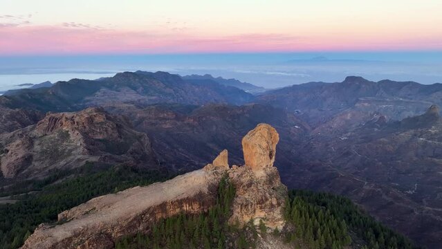 Aerial shot picturesque paradise of Roque Nublo, Flight over of a volcanic rock in caldera of Tejeda, Gran Canaria, Canary islands, Spain.
