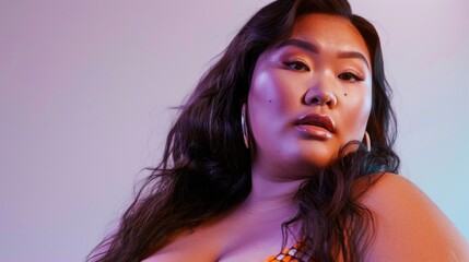 A woman with long dark hair wearing large hoop earrings looking to the side with a soft expression set against a purple gradient background.