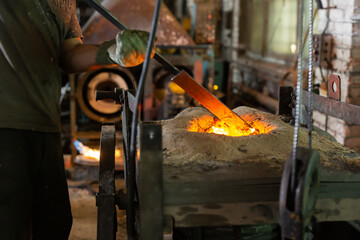 Foundry - ferrous metal is melted in an induction furnace of metallurgical plant