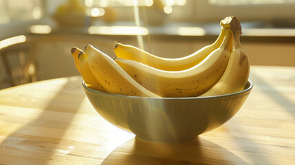 Fresh banana in a bowl on table with a sunlight