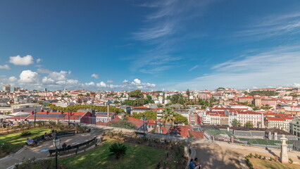 Panorama showing aerial view over the center of Lisbon timelapse from Miradouro de Sao Pedro de Alcantara - obrazy, fototapety, plakaty