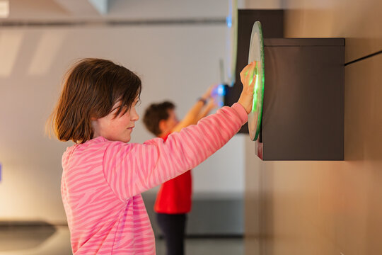 Children engaging with interactive exhibit at science museum