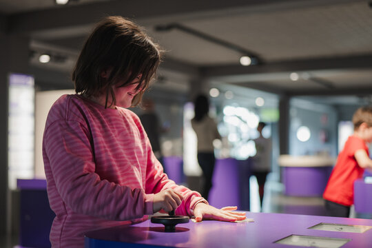 Kids exploring interactive exhibits at a science museum