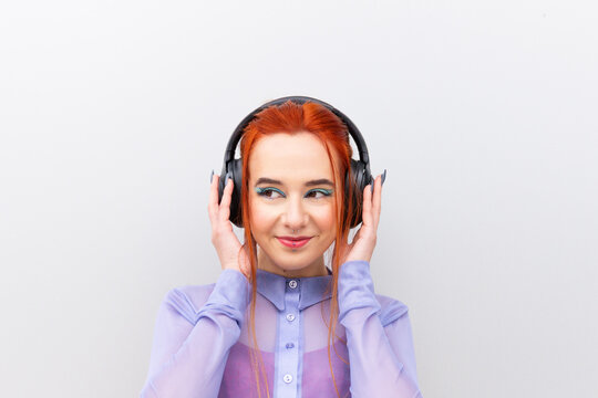 Smiling Businesswoman with Headphones Enjoying Music