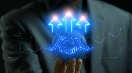 Businessman showing planet earth model and neon line of shaking hand with up arrows icon. Concept for teamwork cooperate together to business achievement. profit, investment, finance and success.