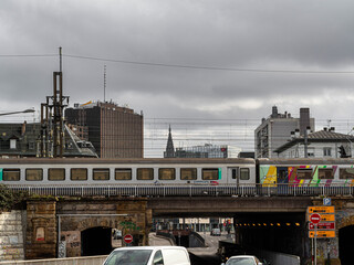 Fototapeta premium Strasbourg in Alsace. Urbanism. Interweaving of wires, trains, buildings, cars, roads.