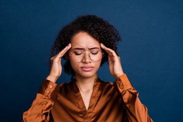 Photo of tired stressed woman dressed brown silk shirt eyewear hands temples overworking isolated blue color background