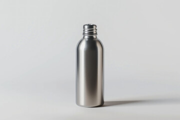 Matte Silver Metal Bottle with Screw Cap on a Soft White Background