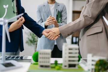 Business team people planning and discussing on recycle reduce reuse policy symbol in office meeting room. Green business company and Solar Energy Environment city