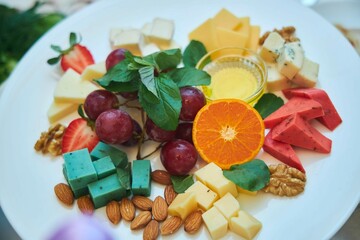 Cheese plate, assorted cheeses. Dishes from the chef in the restaurant. Festive table