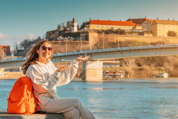 Student or traveller girl exploring Petrovaradin fortress at Novi Sad city in Serbia - obrazy, fototapety, plakaty