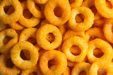 pile of crunchy cheese-flavored ring snacks