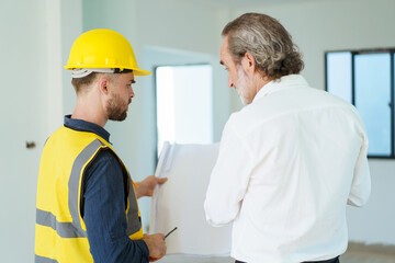 Businessman talking with foreman.