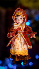 Obraz premium A cotton Christmas ornament amidst blue lights against a beautiful backdrop, evoking an enchanting winter