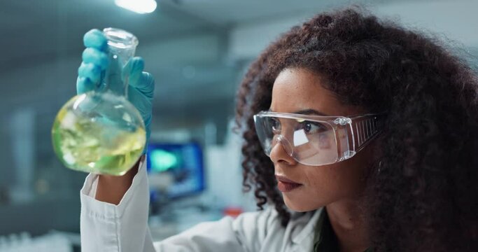 Scientist, research or woman with liquid in test tube for analysis, medical testing and analytics in lab. Biotechnology, healthcare or science person with medicine, sample and vaccine in glass vial