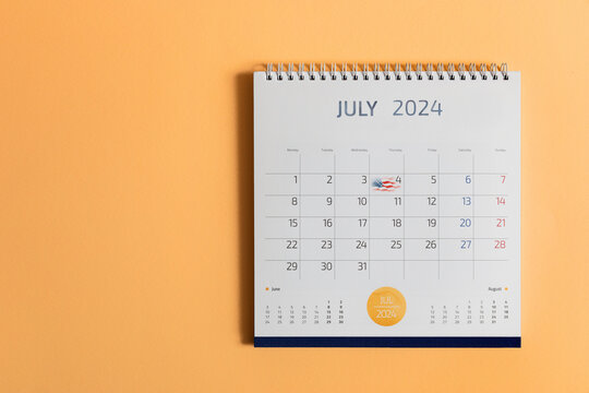 July 2024 desk calendar with marked date 4th of July Usa flag. United States Independence day celebration concept