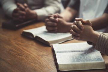 Pray. Hold hands and pray together. For Christian life, worship, faith, and learning together about Christianity. - obrazy, fototapety, plakaty