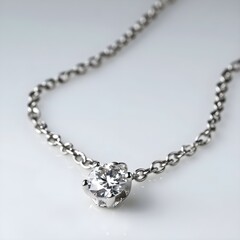 Radiant Allure: A Silver Chain Necklace with a Dazzling Diamond Pendant, Set Against a Whimsical White Backdrop