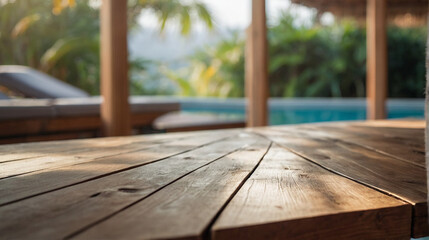 Empty wooden table with heated spa pool in outdoor bokeh in the
background for product display,...
