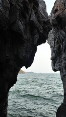 Ocean Cave amidst Rock Formation by the Sea