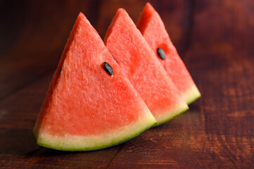 Sliced ​​watermelon on a wooden table.
