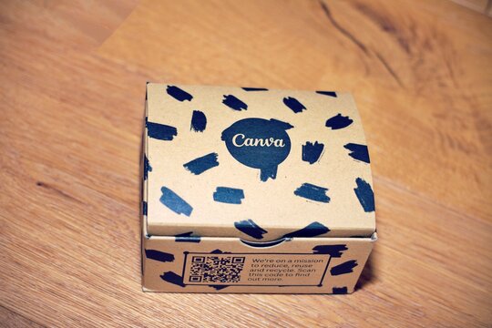 February 27th 2024, Florence, Italy , Canva package box on wooden background. Australian graphic design company Canva Pty Ltd