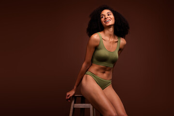 No filter photo of cheerful gorgeous woman wear khaki fashion top panties sporty muscular flawless...