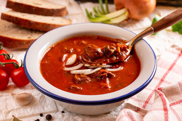 Hungarian goulash soup bograch close-up on the table.