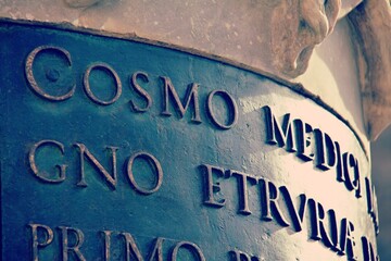 Writing under the statue of Cosimo de Medici, Piazza della Signoria, Florence, Tuscany, Italy