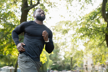 Athletic man jogging in park