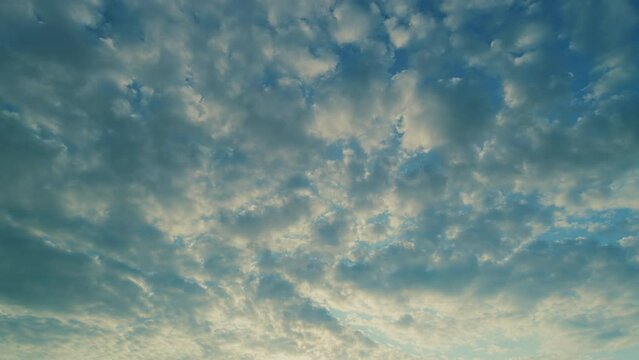 Cirrocumulus with ray light effects. Morning sunset blue sky with wispy smoke cirrocumulus.